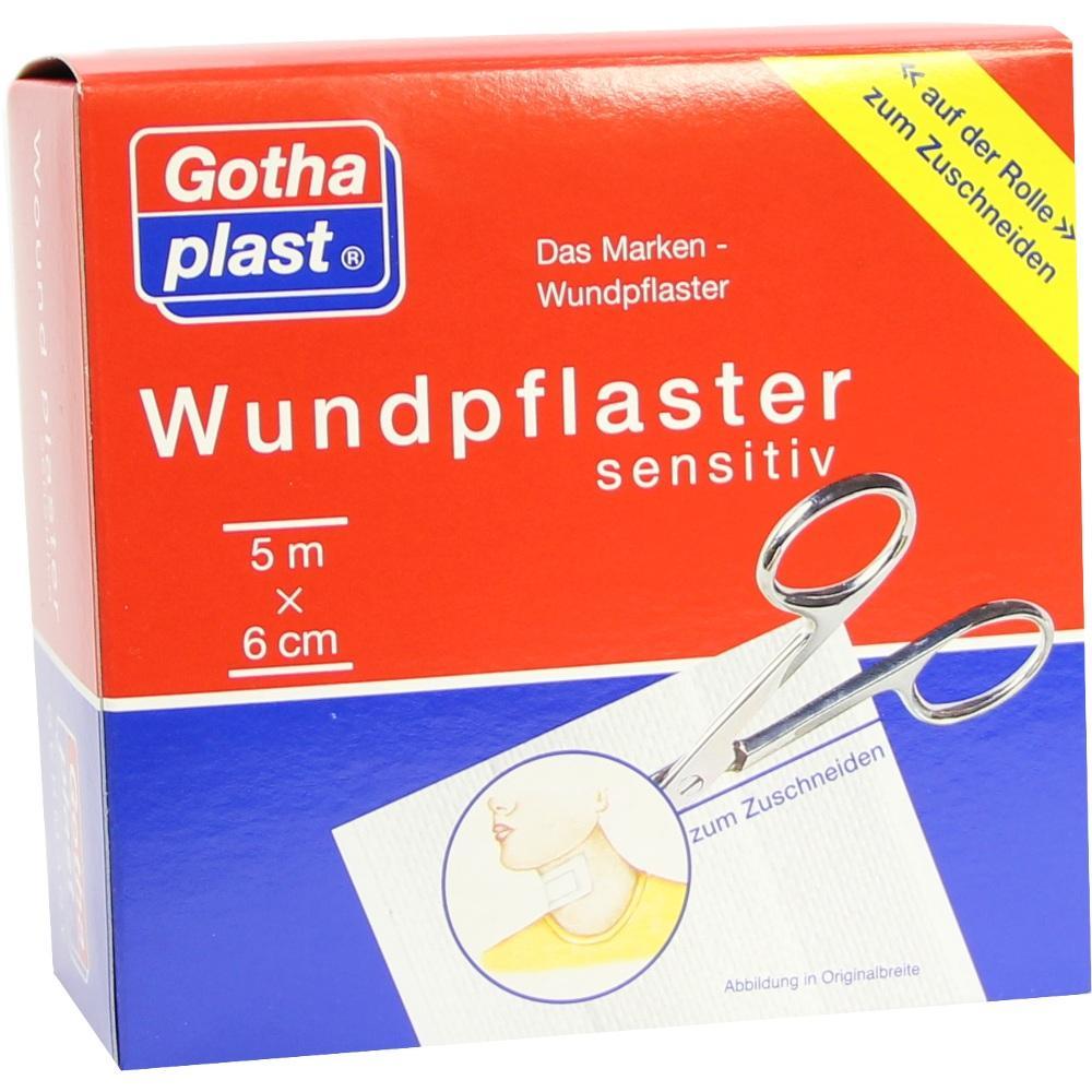 Eine rote Packung mit einem Wundpflaster zum Zuschneiden, Schere abgebildet.