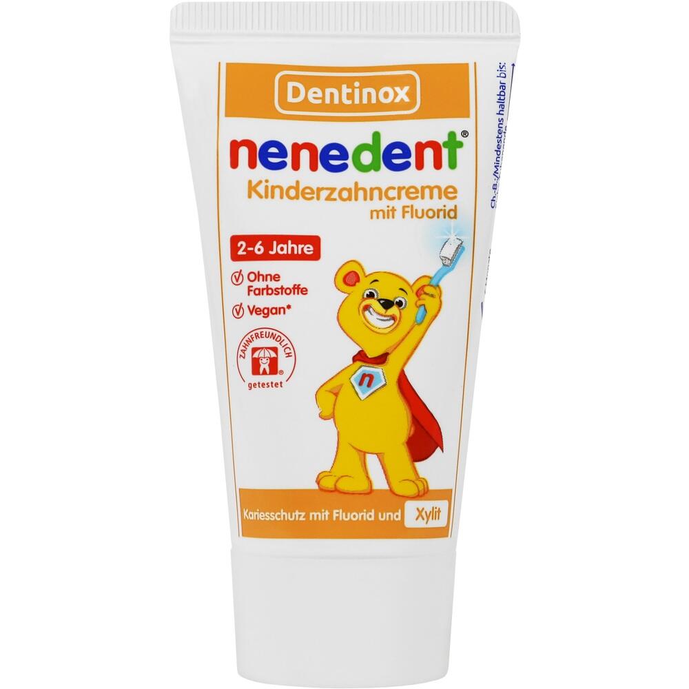 Eine Kinderzahnpasta-Tube mit einem l&auml;chelnden B&auml;ren und einer roten Kappe.